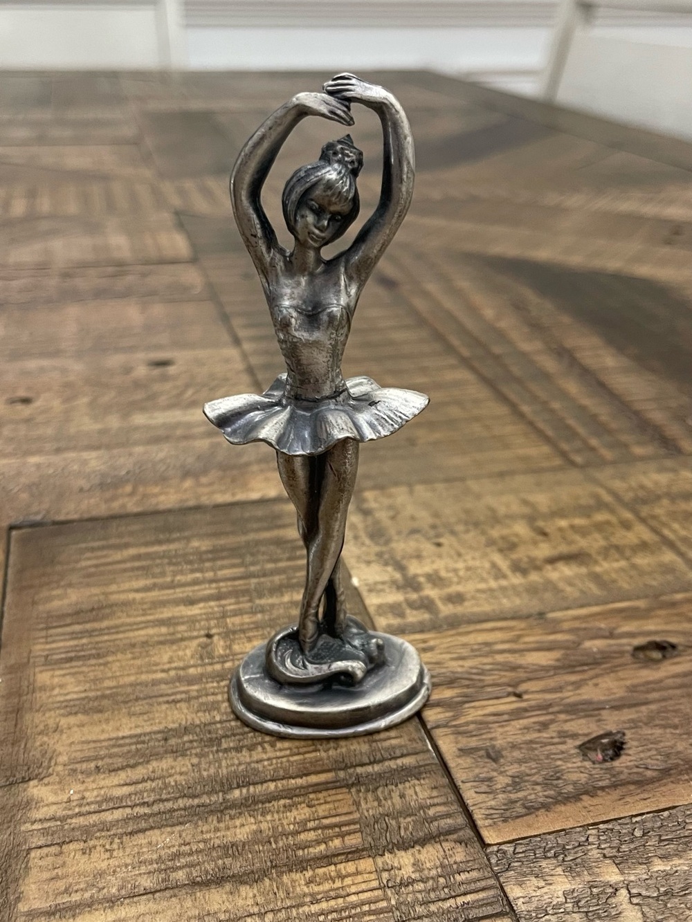 vintage pewter ballerina figurine with a silver-toned finish